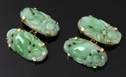 A pair of 750‰ gold cufflinks set with oval jade p