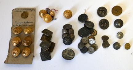 A collection of buttons consisting of six British 