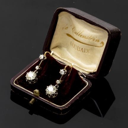 A pair of two-tone 750‰ gold hoop earrings, each s