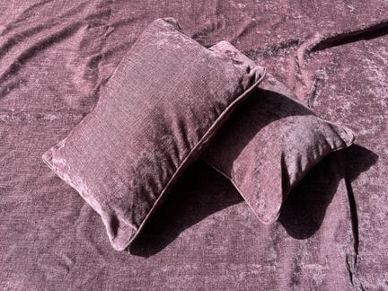 Purple fabric bedspread with cream trim 
258 x 140