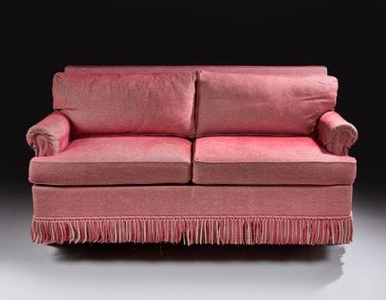Canapé confortable deux places, recouvert d'une to
