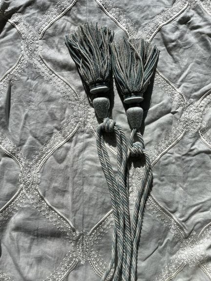 Pair of blue taffeta curtains embroidered with a w