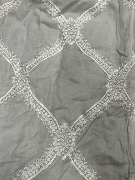 Pair of jacquard curtains with a pearl gray backgr