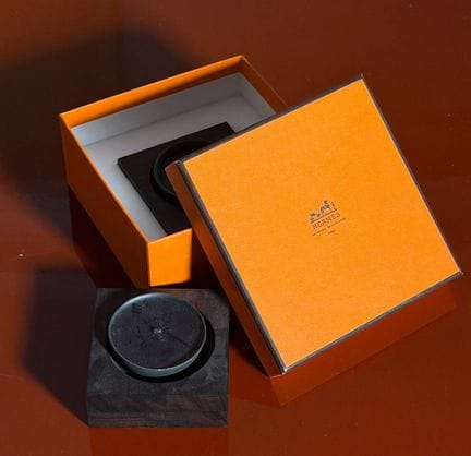 Two Hermès candleholders, one of which comes with 