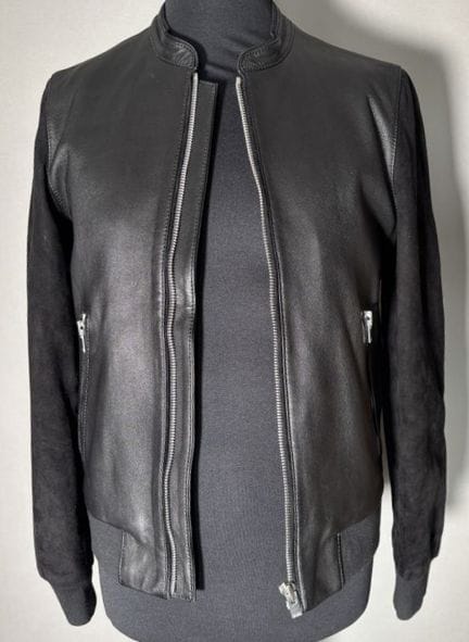 THE KOOPLES 
Black leather jacket. Suede sleeves. 