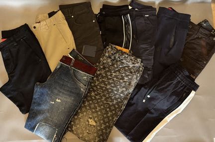 Assortment of pants from various brands, including