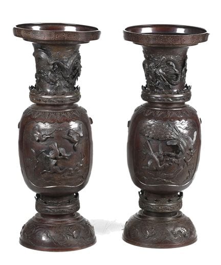 Coppia di vasi in ceramica e metallo con decorazio