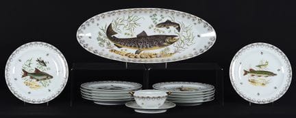 A 12-place-setting fish dinner service made of Lim
