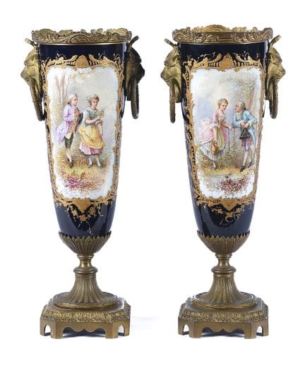 A pair of cups made of cobalt-blue porcelain and b