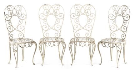 Set consisting of four wrought-iron garden chairs.