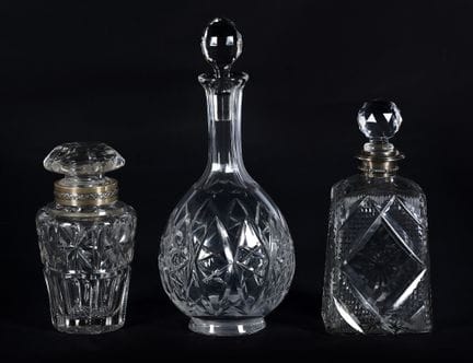 Set consisting of three bottles made of cut glass.