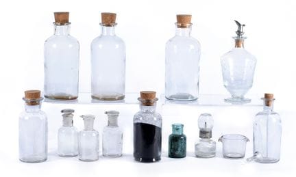 Lot consisting of eleven glass pharmacy bottles. L