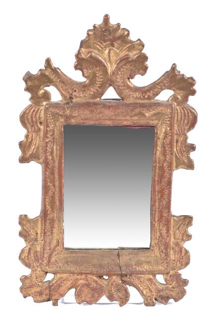 Mirror made of gilded wood. 19th century. 24x15 cm