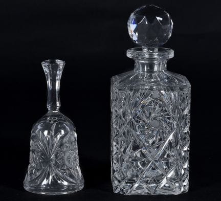 Set consisting of a bottle and a bell made of cut 