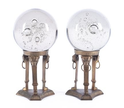 Pair of glass and bronze spheres by Becara. 20th c