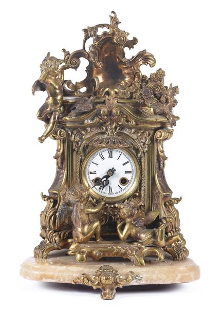 Orologio in bronzo con base in marmo. Inizi del XX