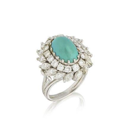ANILLO DE TURQUESA Y DIAMANTES
Adornado con una tu