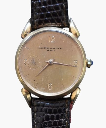 Round watch with curved lugs in the 1950s style, s