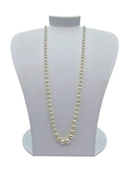 A cascading cultured pearl necklace with a white g