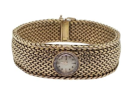 Women's wristwatch with a round gold case, mechani
