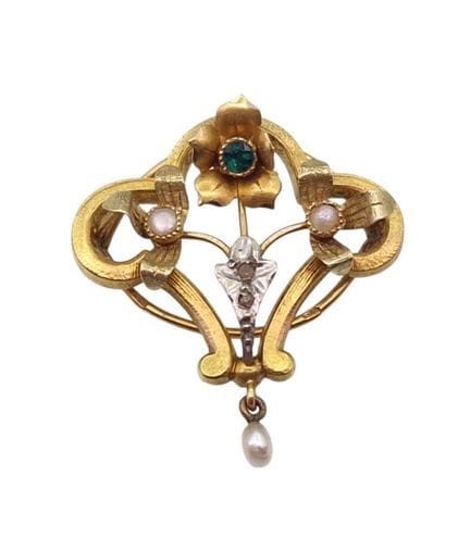 Broche de oro calado con motivos florales y piedra