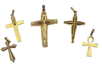 5 gold cross pendants, one of which is set with a 