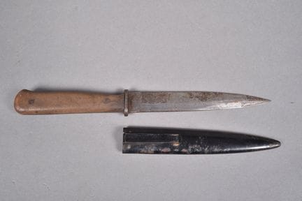 Boot knife. Handle with riveted wooden scales. Bla