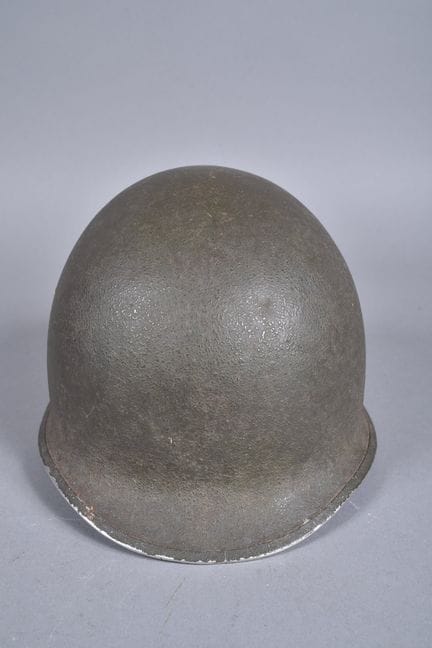 US—M1 helmet. Green-painted steel shell. Metal ban