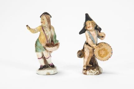Two polychrome porcelain figures. Different manufa