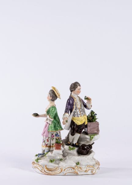 Polychrome porcelain group depicting two figures i