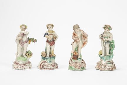 A set of four porcelain figures depicting allegori