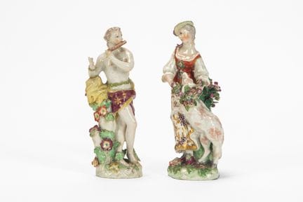 Two polychrome porcelain pastoral figures, depicti
