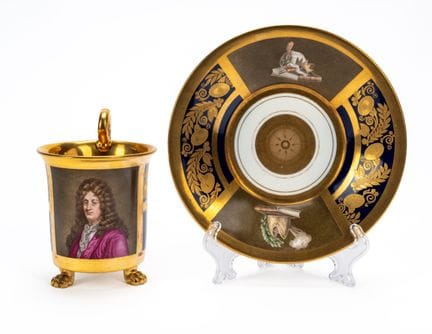 Porcelain cup and saucer with a gold and blue grou