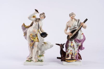 Two polychrome porcelain groups depicting the alle