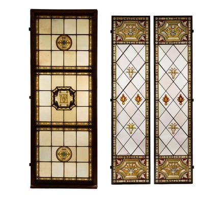 Pair of stained glass windows painted with grotesq