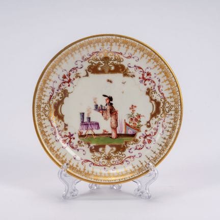 White porcelain saucer decorated with gilding and 