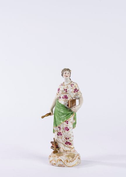 Polychrome porcelain figurine depicting Clio. Meis
