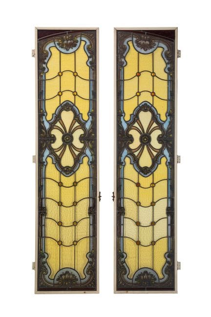 A pair of leaded stained-glass windows with a vaul