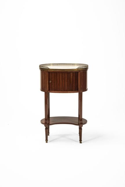 Oval-shaped bedside table with a marble top and a 