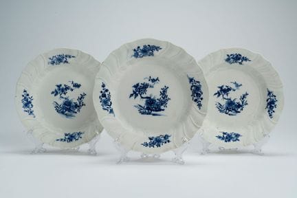 Three porcelain plates with a wavy, ribbed rim in 