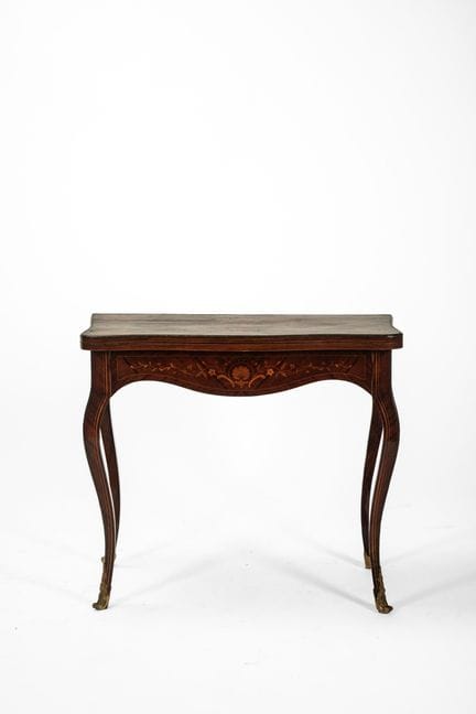 Veneered and inlaid game table with a book-shaped 