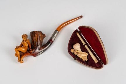 Two meerschaum pipes carved with female figures. 1