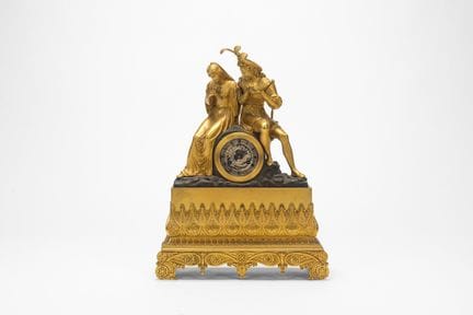 A gilded and burnished bronze pendulum clock surmo