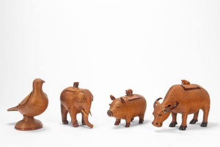 Four animal-shaped containers made of wicker and l