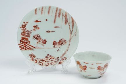 Porcelain cup and saucer decorated with iron-red a