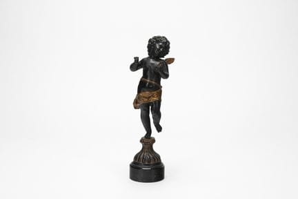 Patinated and gilded bronze sculpture depicting a 