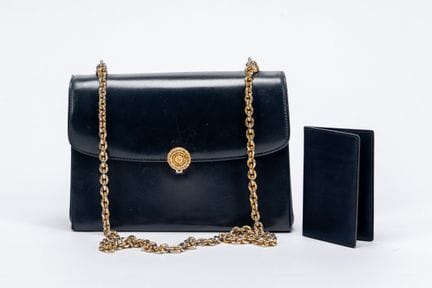 Gucci - Bag, 1970s 


Dark blue leather bag, gold-