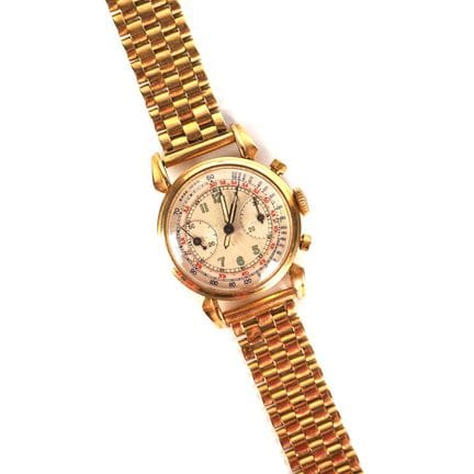 Wristwatch—chronograph in 18K yellow gold (750/oo)