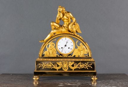 A large chiseled and gilded bronze clock. The move