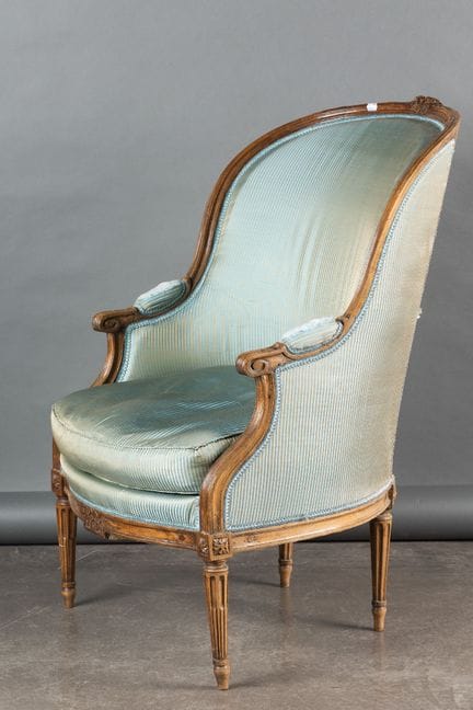 Gondola-style armchair in molded and carved beech,